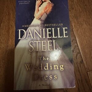 The wedding dress by Danielle steel. Paperback. Some minor bending (pictured)